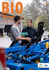 Page de couverture du Bioactualités 10|24: Un homme et une femme se parlent, ils sont devant une machine agricole.